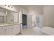 Open bathroom featuring granite countertops, double doors, and marble tiling at 145 Bre Dr, Fayetteville, GA 30215