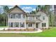Charming two-story home featuring stone accents, a welcoming entryway, and a beautifully landscaped front yard at 145 Bre Dr, Fayetteville, GA 30215