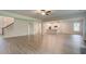 Open-concept living space with hardwood floors adjacent to modern kitchen at 145 Bre Dr, Fayetteville, GA 30215