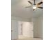 Spacious main bedroom featuring a ceiling fan and double doors at 145 Bre Dr, Fayetteville, GA 30215