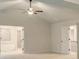 Spacious main bedroom featuring a ceiling fan, ensuite bathroom, and double doors at 145 Bre Dr, Fayetteville, GA 30215