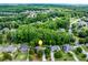 A peaceful neighborhood showcases beautiful single-Gathering homes surrounded by lush, mature trees and landscaping at 2285 Ashton Ridge Dr, Dacula, GA 30019