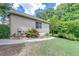 Exterior of home with a small yard with green grass and healthy landscaping at 2285 Ashton Ridge Dr, Dacula, GA 30019
