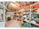 Unfinished basement with exposed ceiling and built in shelving at 2285 Ashton Ridge Dr, Dacula, GA 30019