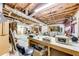 Unfinished basement space with workbench, shelving and ample room at 2285 Ashton Ridge Dr, Dacula, GA 30019