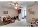 Cozy bedroom featuring neutral walls, ceiling fan, and natural light at 2285 Ashton Ridge Dr, Dacula, GA 30019
