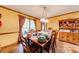 Bright dining room with hardwood floors, offering ample space for entertaining guests at 2285 Ashton Ridge Dr, Dacula, GA 30019