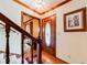 Elegant foyer with hardwood floors, decorative door, and staircase at 2285 Ashton Ridge Dr, Dacula, GA 30019