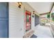 Charming front porch featuring a decorative glass door and stylish exterior lighting at 2285 Ashton Ridge Dr, Dacula, GA 30019
