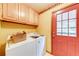 Functional laundry area with appliances, storage, and exterior access at 2285 Ashton Ridge Dr, Dacula, GA 30019
