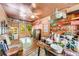 Cozy sun room featuring eclectic decor, wooden floors, and multiple windows at 2285 Ashton Ridge Dr, Dacula, GA 30019