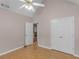Bedroom featuring hardwood floors, a ceiling fan, and double door closet at 445 Royal St, Mcdonough, GA 30253