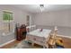 Bright dining area with natural light, stylish chandelier, and a table set for four at 445 Royal St, Mcdonough, GA 30253