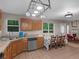 Spacious kitchen features a breakfast nook, stainless steel appliances, and backyard view at 445 Royal St, Mcdonough, GA 30253