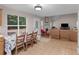 Eat-in kitchen features a view to the living room and access to the backyard at 445 Royal St, Mcdonough, GA 30253