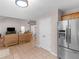 Open kitchen features stainless steel appliances, ample counter space, and access to the living room at 445 Royal St, Mcdonough, GA 30253