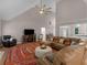 Spacious living room features vaulted ceilings, a fireplace, and a cozy seating area at 445 Royal St, Mcdonough, GA 30253