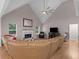 Bright living room featuring vaulted ceilings, fireplace, and large windows at 445 Royal St, Mcdonough, GA 30253