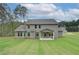 A large backyard with a covered patio and ample green space at 72 Homesite Cooper W Cv, Fayetteville, GA 30215