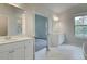 Bright bathroom featuring double vanity, marble floors, and separate shower showcasing the home's elegant design at 72 Homesite Cooper W Cv, Fayetteville, GA 30215