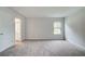 A spacious bedroom features neutral walls, plush carpeting, and a bright window at 72 Homesite Cooper W Cv, Fayetteville, GA 30215