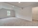 A spacious bedroom features neutral walls, plush carpeting, a window, and walk-in closet at 72 Homesite Cooper W Cv, Fayetteville, GA 30215