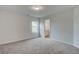 A roomy bedroom offers neutral walls and carpeting plus ensuite bathroom access at 72 Homesite Cooper W Cv, Fayetteville, GA 30215