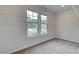 Bright walk-in closet featuring wire shelving and a window offering natural light at 72 Homesite Cooper W Cv, Fayetteville, GA 30215