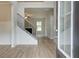 Inviting entryway featuring beautiful floors, staircase, and plenty of natural light showcasing the home's elegant design at 72 Homesite Cooper W Cv, Fayetteville, GA 30215
