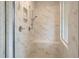 Elegant walk-in shower with marble tile, bench, and modern fixtures showcasing the luxurious bathroom design at 72 Homesite Cooper W Cv, Fayetteville, GA 30215