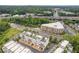 Aerial view of townhomes near highway and surrounded by green trees at 830 Stone Ridge Ln, Atlanta, GA 30324