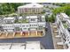 Aerial view of townhome community featuring manicured lawns and modern architecture at 830 Stone Ridge Ln, Atlanta, GA 30324