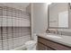 Bathroom featuring a shower with a striped curtain, toilet and a sink with a dark wood cabinet at 830 Stone Ridge Ln, Atlanta, GA 30324