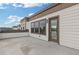 Spacious outdoor deck features neutral siding, windows, and a door to a modern townhome at 830 Stone Ridge Ln, Atlanta, GA 30324