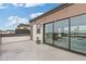 Expansive outdoor deck leads to a sliding glass door and a view of the city skyline at 830 Stone Ridge Ln, Atlanta, GA 30324