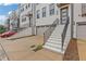 Upscale painted brick townhomes with individual garages and landscaped entry stairs at 830 Stone Ridge Ln, Atlanta, GA 30324
