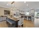 Modern kitchen and dining area featuring stainless steel appliances and a large island at 830 Stone Ridge Ln, Atlanta, GA 30324