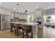 Gourmet kitchen with stainless steel appliances, a large island, and modern pendant lighting at 830 Stone Ridge Ln, Atlanta, GA 30324