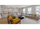 Spacious living area featuring modern decor, large windows, and comfortable seating at 830 Stone Ridge Ln, Atlanta, GA 30324
