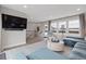 Open living area with large windows, natural light, and a cozy seating arrangement for relaxation at 830 Stone Ridge Ln, Atlanta, GA 30324