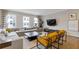 Stylish living room featuring hardwood floors, large windows, and comfortable seating at 830 Stone Ridge Ln, Atlanta, GA 30324