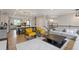 Open concept living area flows into kitchen featuring modern décor and seating at 830 Stone Ridge Ln, Atlanta, GA 30324