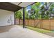 Covered outdoor patio with wood fence perfect for relaxing and entertaining guests at 830 Stone Ridge Ln, Atlanta, GA 30324