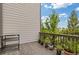 Outdoor patio area with potted plants, wood decking, and a metal serving cart at 830 Stone Ridge Ln, Atlanta, GA 30324