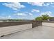 An open-air outdoor deck with views of the city skyline and beautiful trees at 830 Stone Ridge Ln, Atlanta, GA 30324