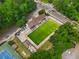 High aerial showcasing the community pool and the adjacent tennis courts at 1177 Church St # A, Decatur, GA 30030
