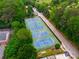 Aerial shot featuring the community's tennis courts surrounded by lush greenery and mature trees at 1177 Church St # A, Decatur, GA 30030