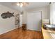 Bedroom featuring hardwood floors, ample natural light and closet with sliding doors at 1177 Church St # A, Decatur, GA 30030