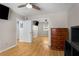 Bedroom with closet featuring mirror doors, ceiling fan, and hardwood floors at 1177 Church St # A, Decatur, GA 30030
