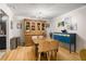 The dining room features hardwood floors, stylish lighting, and a dining table with chairs at 1177 Church St # A, Decatur, GA 30030